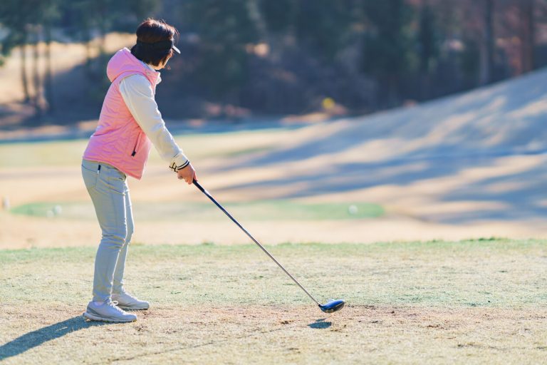 woman-on-golf-course-winter