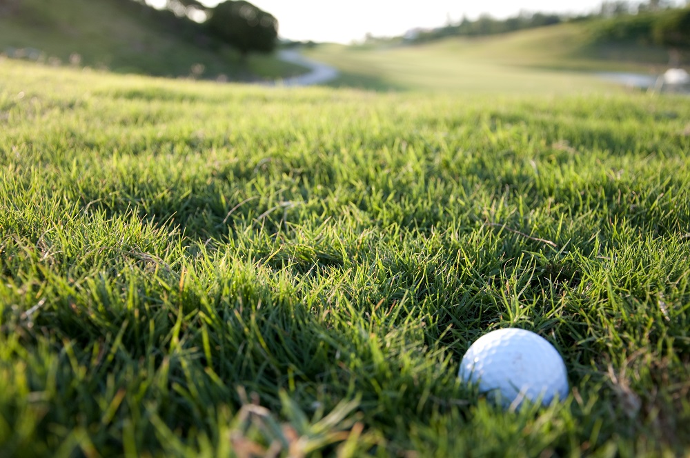 How to hit a golf ball out of thick rough